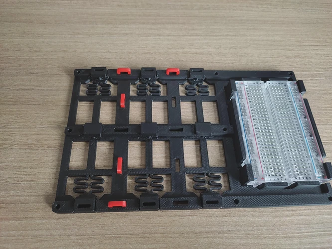 Lastest version (v2), come with cableties loop with optional brreadboard holder